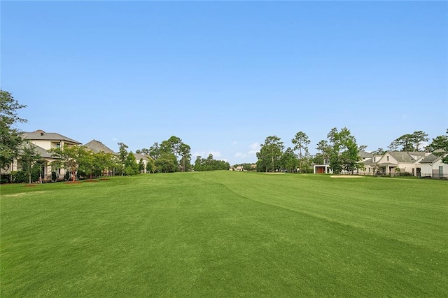 surrounding community featuring a lawn