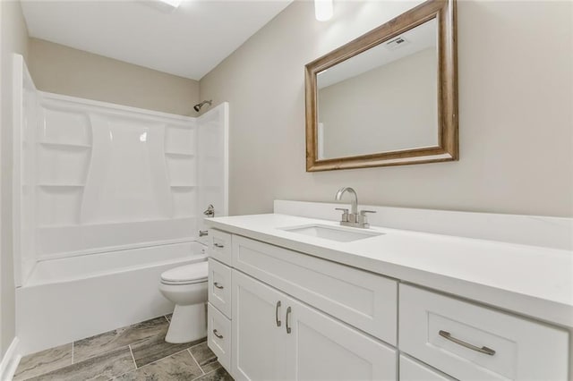 bathroom with bathtub / shower combination, visible vents, vanity, and toilet