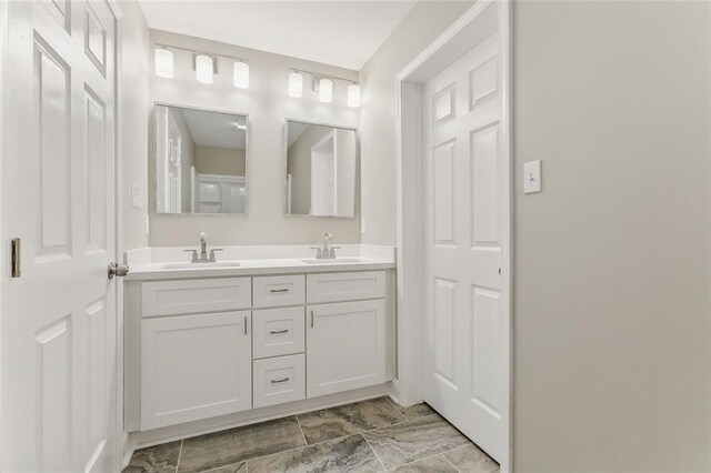 bathroom with tile patterned flooring and vanity