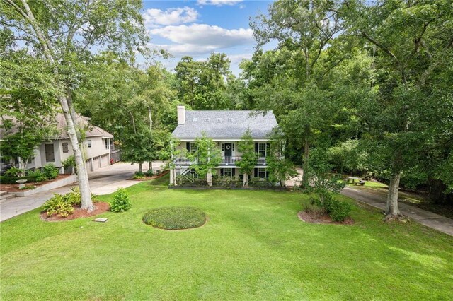 view of front of property with a garage and a front yard