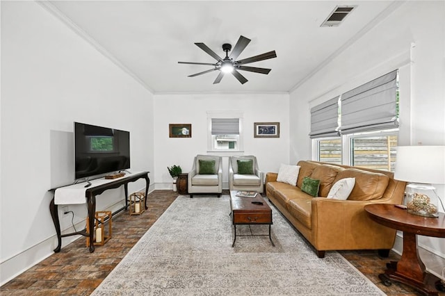 tiled living room with ceiling fan and ornamental molding