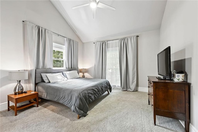 carpeted bedroom with ceiling fan and vaulted ceiling