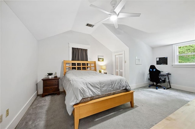 bedroom with ceiling fan, carpet flooring, and vaulted ceiling