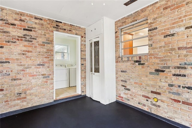 doorway to property featuring washing machine and clothes dryer