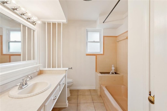 full bathroom with vanity, tile patterned floors, tiled shower / bath, and toilet