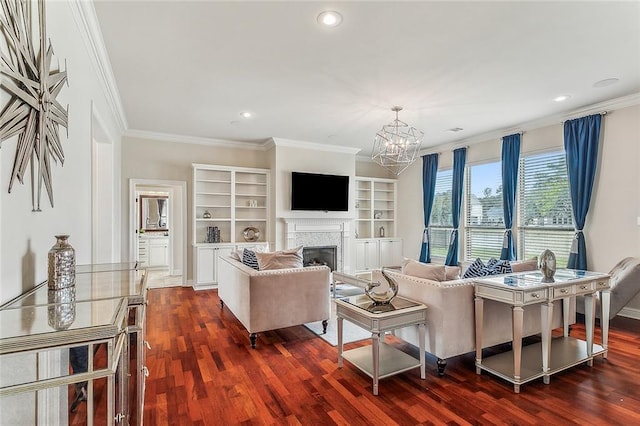 living room with a notable chandelier, built in shelves, dark wood-type flooring, and crown molding