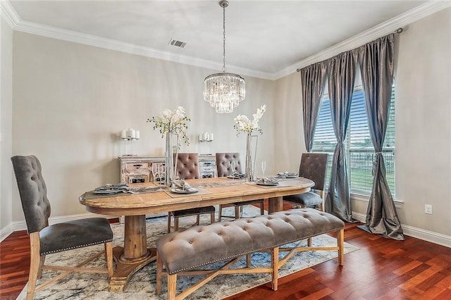 dining area with ornamental molding, hardwood / wood-style floors, and a notable chandelier