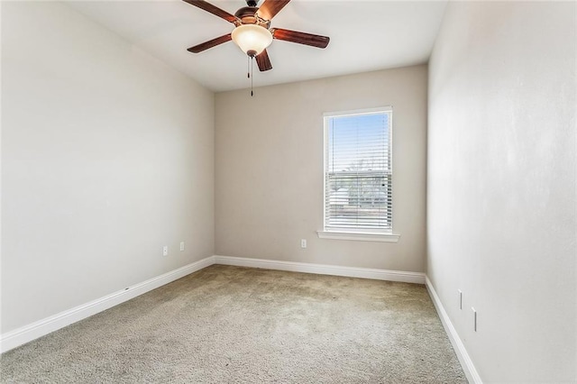 unfurnished room with ceiling fan and carpet floors