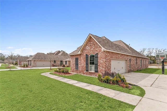 view of front of property with a garage and a front yard