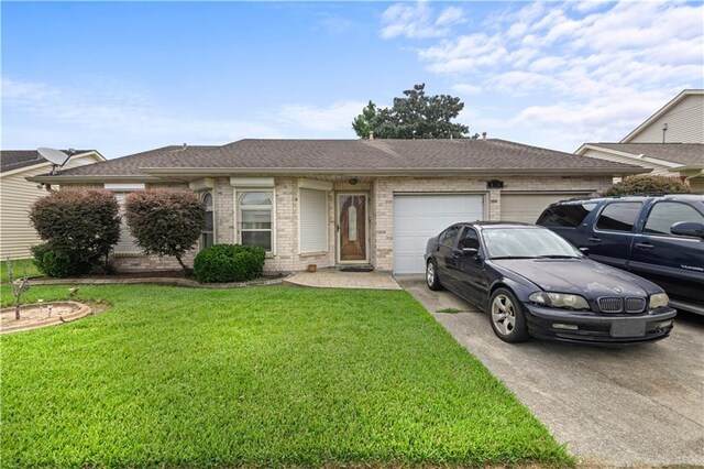 ranch-style home featuring a garage and a front yard