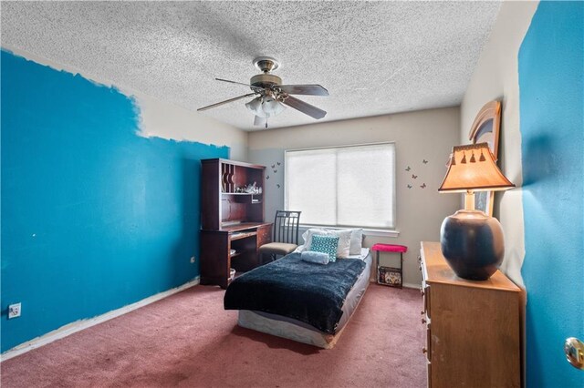 carpeted bedroom with a textured ceiling and ceiling fan