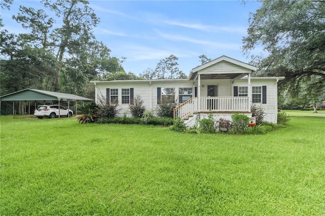 view of front facade with a front lawn, a carport, and covered porch