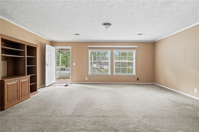 unfurnished living room with ornamental molding, carpet, and a wealth of natural light