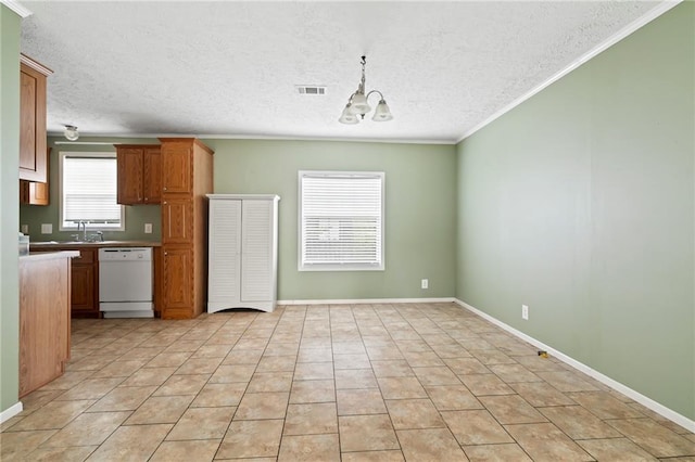 kitchen featuring white dishwasher, a notable chandelier, ornamental molding, and a textured ceiling