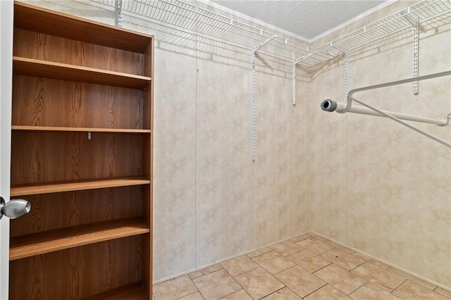 spacious closet featuring tile patterned flooring