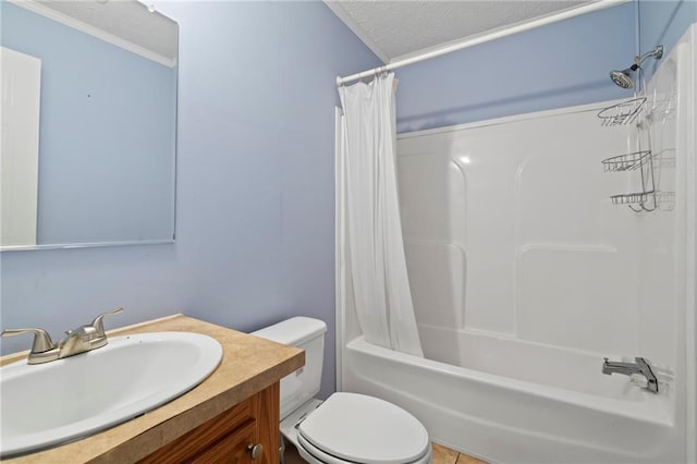 full bathroom featuring vanity, ornamental molding, a textured ceiling, toilet, and shower / bath combo with shower curtain