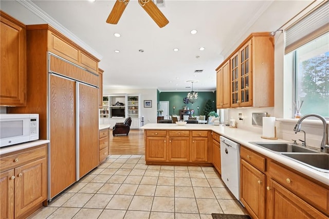 kitchen featuring white appliances, kitchen peninsula, ceiling fan, light hardwood / wood-style floors, and sink