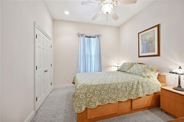 carpeted bedroom featuring ceiling fan