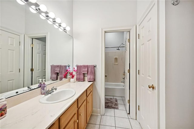 bathroom with vanity, tile patterned floors, and washtub / shower combination