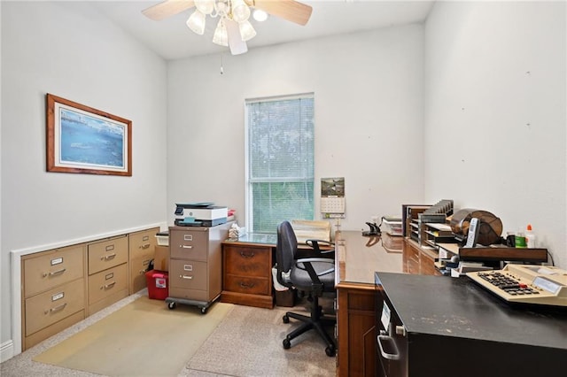 carpeted office with ceiling fan