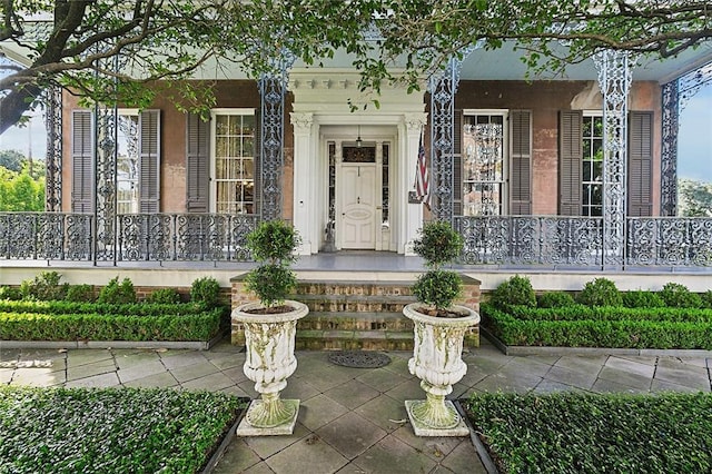 2027 Carondelet St, New Orleans, LA 70130 - doorway to property featuring a porch