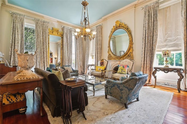 2027 Carondelet St, New Orleans, LA 70130 - sitting room featuring hardwood / wood-style floors, crown molding, and a chandelier