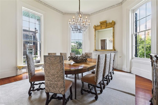 2027 Carondelet St, New Orleans, LA 70130 - dining space with dark wood-type flooring, a healthy amount of sunlight, and a chandelier