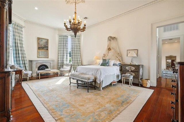 2027 Carondelet St, New Orleans, LA 70130 - bedroom with multiple windows, crown molding, and dark wood-type flooring