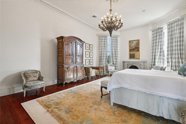 2027 Carondelet St, New Orleans, LA 70130 - bedroom featuring crown molding, dark hardwood / wood-style flooring, multiple windows, and a notable chandelier