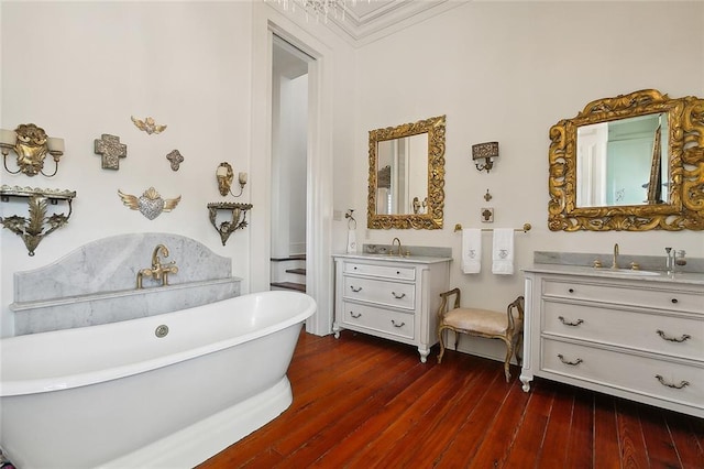 2027 Carondelet St, New Orleans, LA 70130 - bathroom featuring wood-type flooring, vanity, and a bathtub