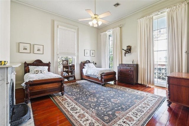 2027 Carondelet St, New Orleans, LA 70130 - bedroom featuring wood-type flooring, crown molding, and a ceiling fan