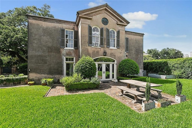 2027 Carondelet St, New Orleans, LA 70130 - view of front of home featuring a front yard and french doors