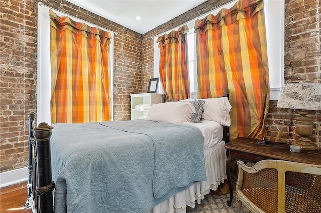 2027 Carondelet St, New Orleans, LA 70130 - bedroom featuring brick wall