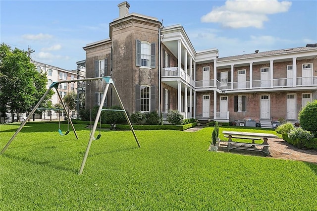 2027 Carondelet St, New Orleans, LA 70130 - exterior space with a playground and a lawn