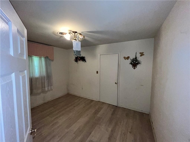 spare room featuring hardwood / wood-style flooring