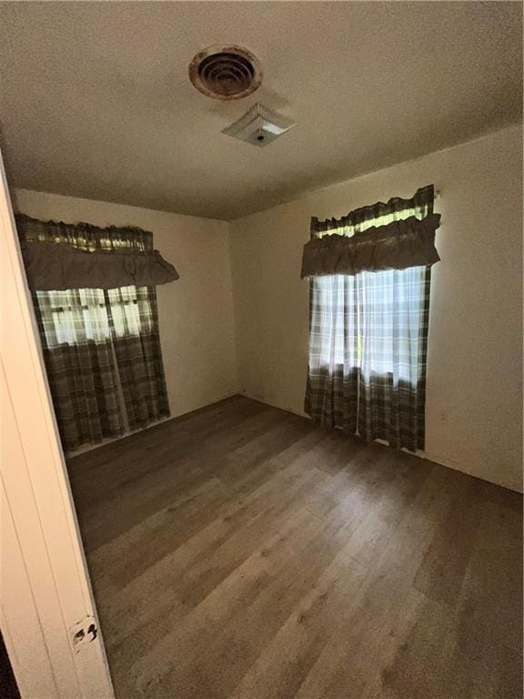 empty room with wood-type flooring