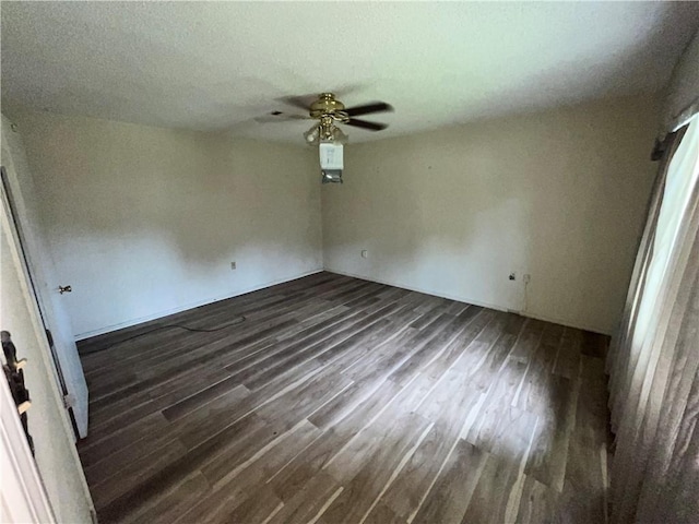 unfurnished room with ceiling fan and hardwood / wood-style flooring