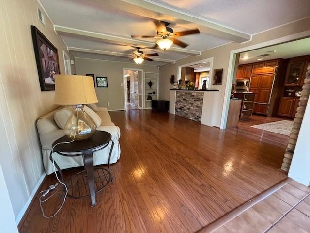 living room with light wood-type flooring and ceiling fan