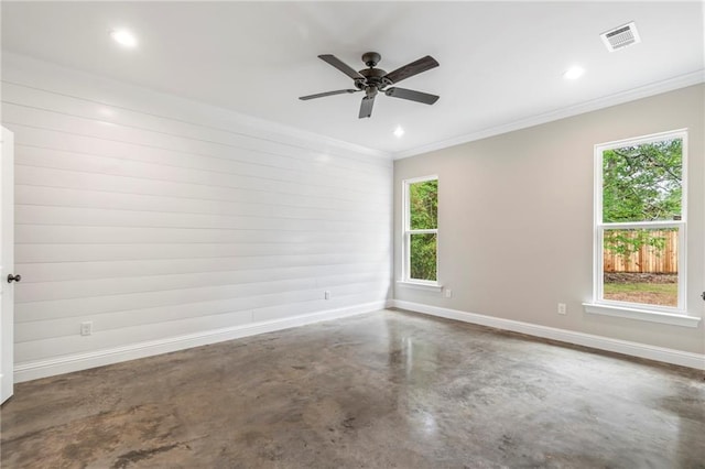 empty room with concrete flooring and ceiling fan