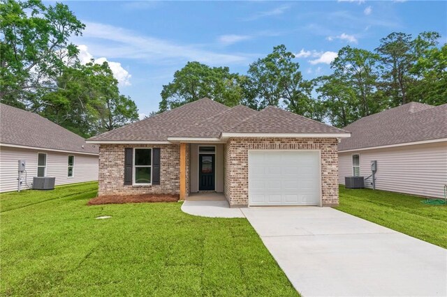 single story home with central AC unit, a garage, and a front lawn