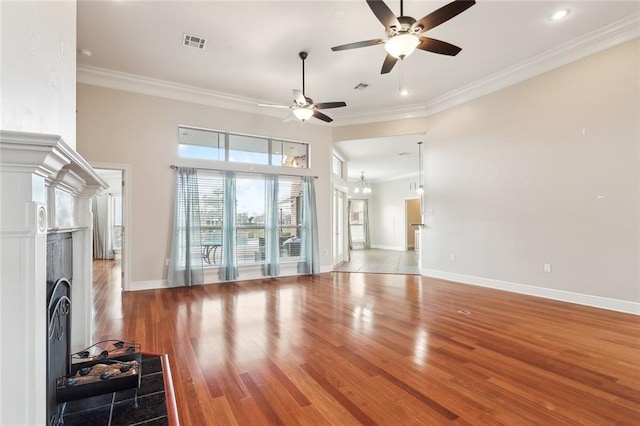 living room featuring wood-type flooring, ceiling fan, and crown molding