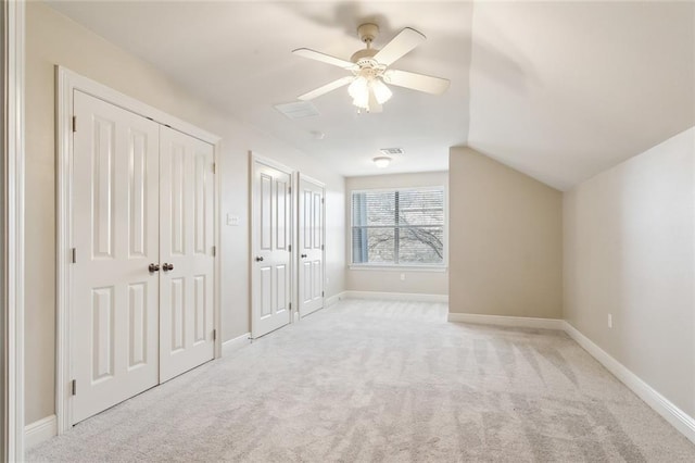 additional living space featuring ceiling fan, light carpet, and vaulted ceiling