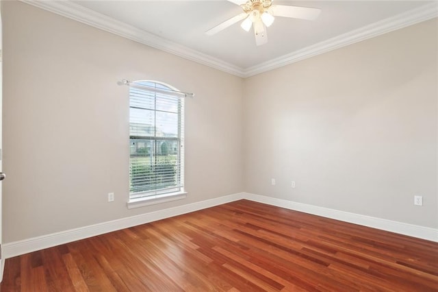 unfurnished room with plenty of natural light, hardwood / wood-style floors, and ornamental molding