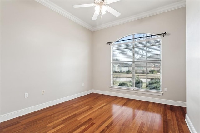 unfurnished room featuring ceiling fan, dark hardwood / wood-style flooring, and crown molding