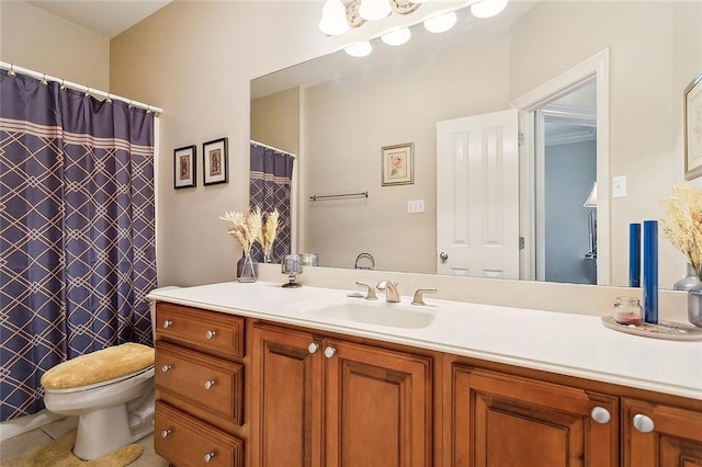 bathroom with tile patterned floors, vanity, and toilet