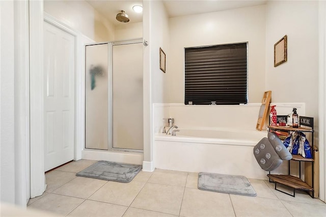 bathroom with tile patterned flooring and independent shower and bath