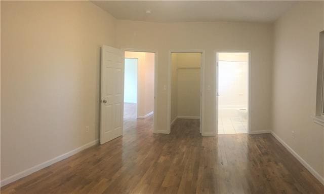 empty room featuring dark hardwood / wood-style floors