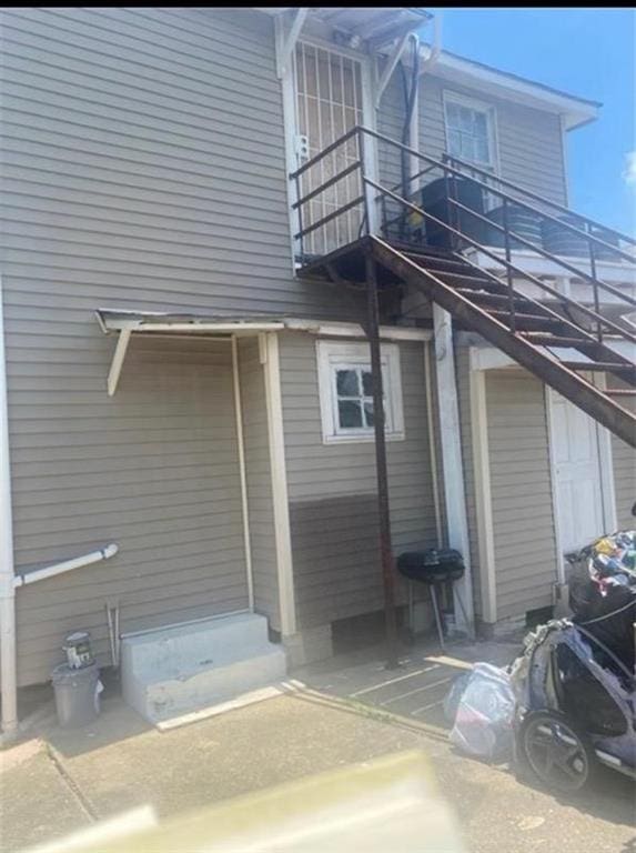 view of home's exterior with a balcony