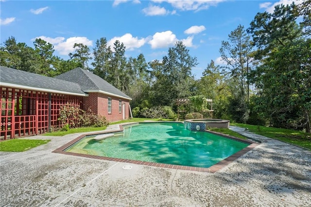 view of pool featuring an in ground hot tub and a patio area