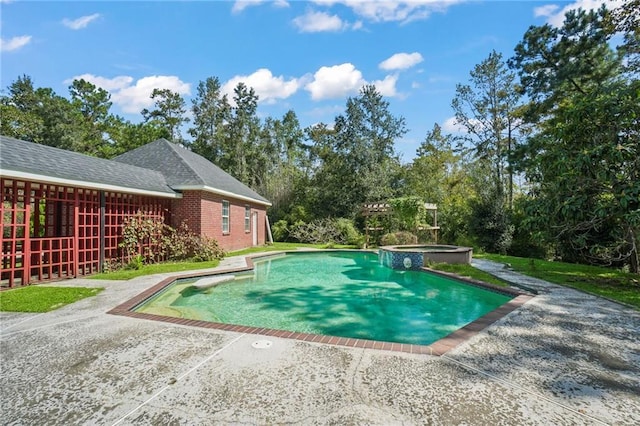 30 River Cypress Ln, Madisonville, LA 70447 - view of swimming pool featuring a patio area, a pool with connected hot tub, and view of scattered trees